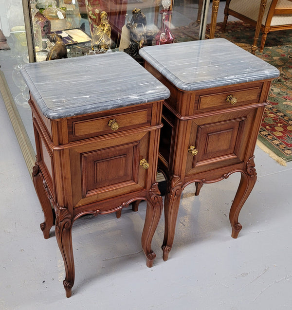 Pair of Walnut Louis XV style grey marble top bedside cabinets. Single drawer, one cupboard and lovely French cabriole legs. They have been sourced from France and are in good original condition.