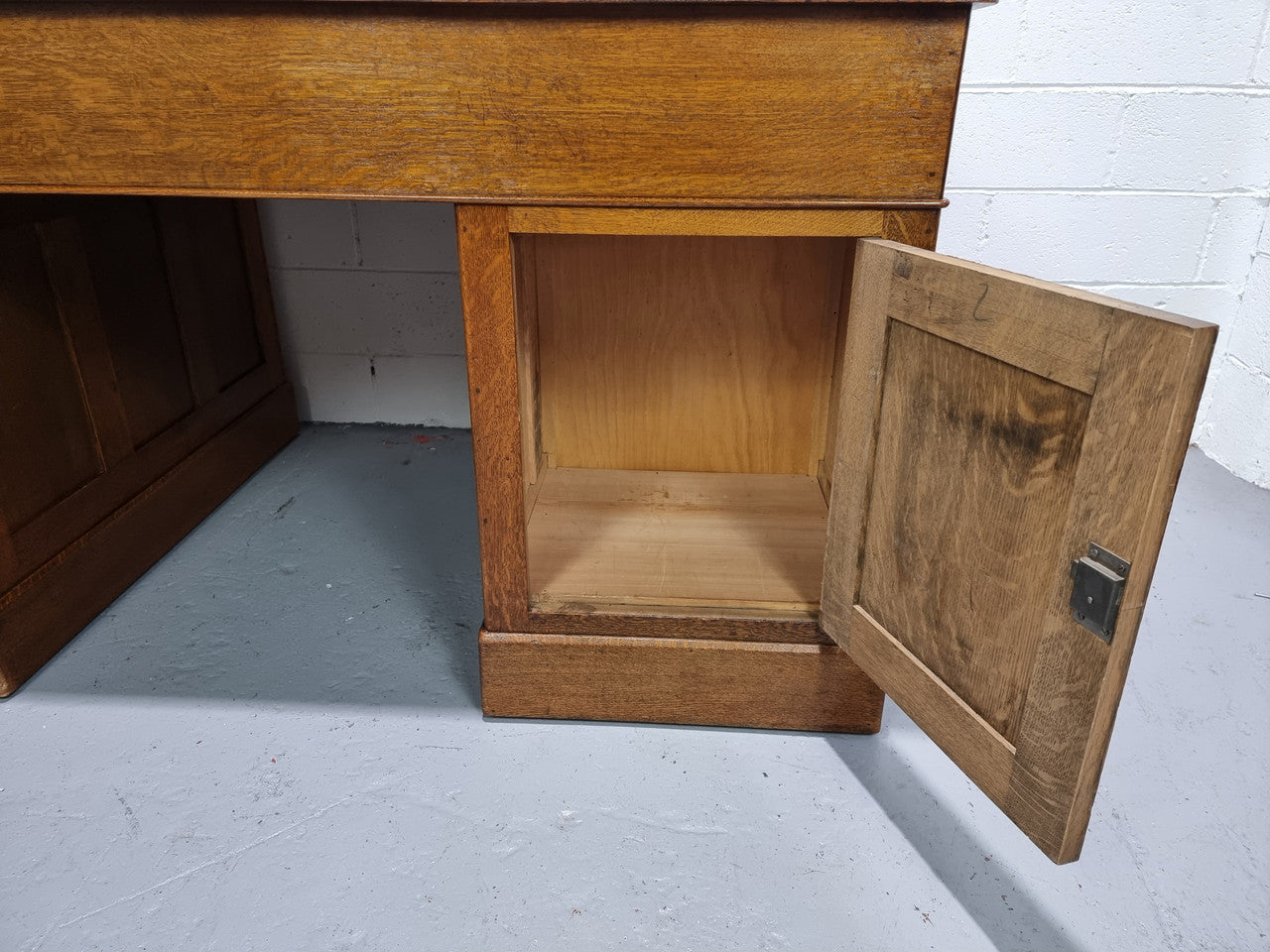 Amazing American Oak full partners leather top desk. Plenty of storage space with nine drawers on one side and two cupboards of the oppsite side. It is in good restored condition and has a new leather and gold tooled inset top.