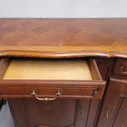 French Oak Louis XV style three drawer three door parquetry top sideboard. It has been sourced from France and is in good original detailed condition.
