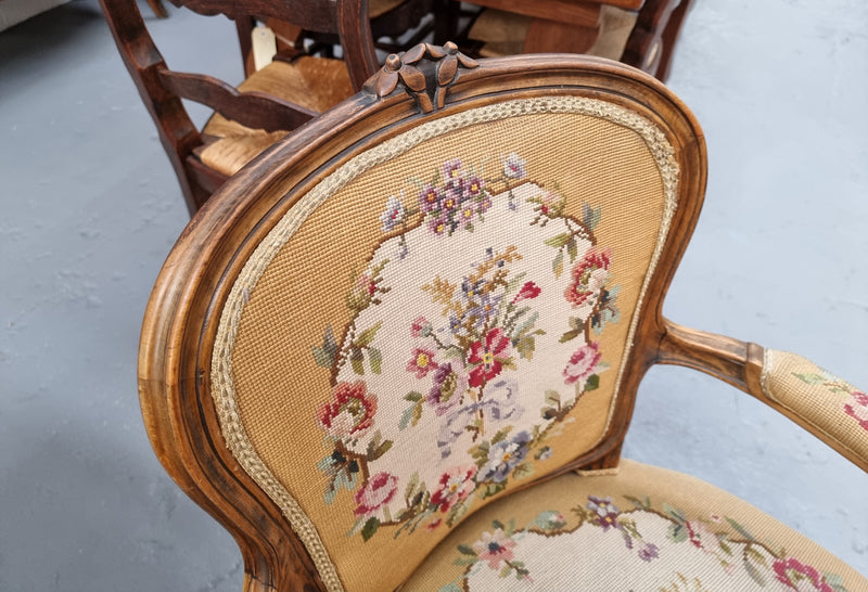 Louis XV style Walnut and tapestry armchair. Very comfortable to sit in and tapestry is in good original used condition.