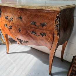 French marquetry inlaid Kingwood marble top commode. It has two drawers and beautiful mounts. Is in good original detailed condition.