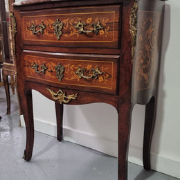 A stunning French petite two drawer inlaid Rosewood commode. In good original detailed condition.