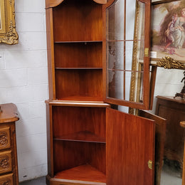 Practical Walnut corner cabinet with display and storage. Two shelf glass display on top and single shelf cupboard below. Sourced locally and in good original detailed condition.