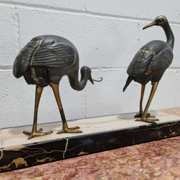 Fabulous French Art Deco cold painted spelter Ibis birds on a stylized Art Deco marble base. Signed "Rochard" circa 1930's. In good original detailed condition.