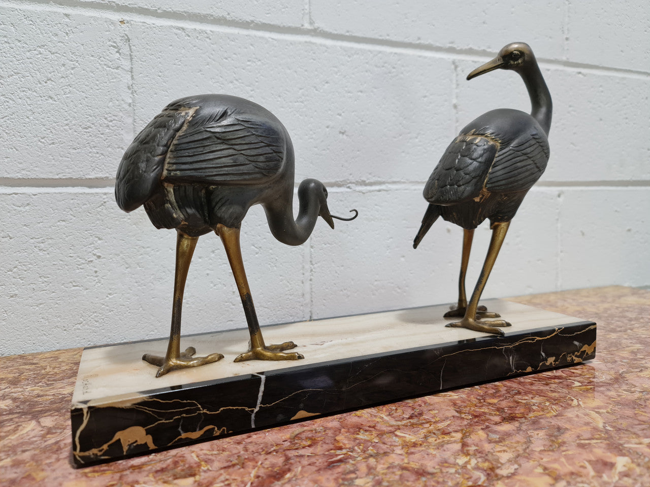 Fabulous French Art Deco cold painted spelter Ibis birds on a stylized Art Deco marble base. Signed "Rochard" circa 1930's. In good original detailed condition.