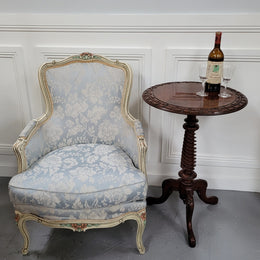 Rare early Victorian Irish Burr Walnut wine table. It has a beautiful carvings and a stunning burr walnut top, on a barley twist column and three shaped legs. It has been sourced locally and is in good original detailed condition. We also have a second table being sold separately which when together make a matched pair.