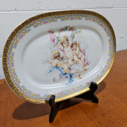 Beautiful T. Limoges porcelain decorative oval plate depicting 3 cherubs with gold edging. In good original condition.