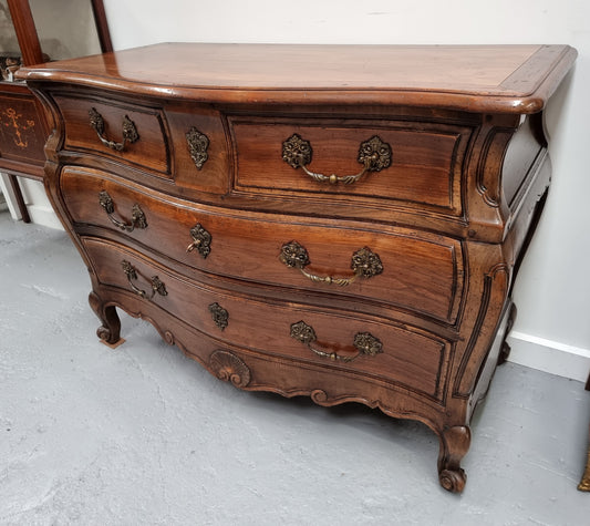 Rare wooden top Walnut Louis XV style three drawer bombe commode. Beautifully carved and is in good original detailed condition.