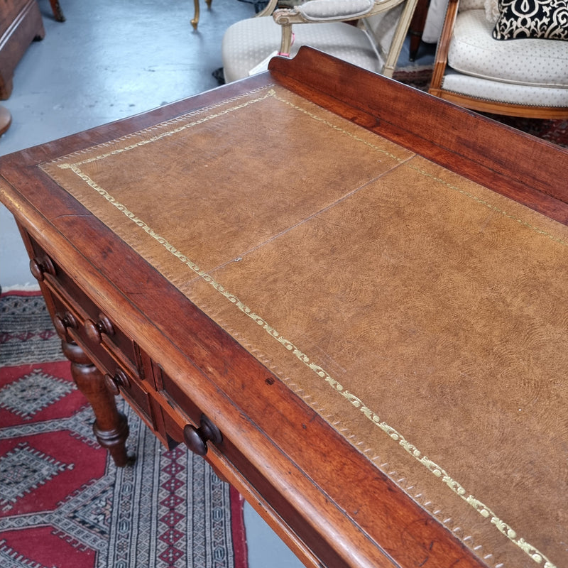 Lovely Victorian Cedar leather tooled  top desk, with five drawers on castors and of pleasing proportions. In very good original detailed condition and has been sourced locally.