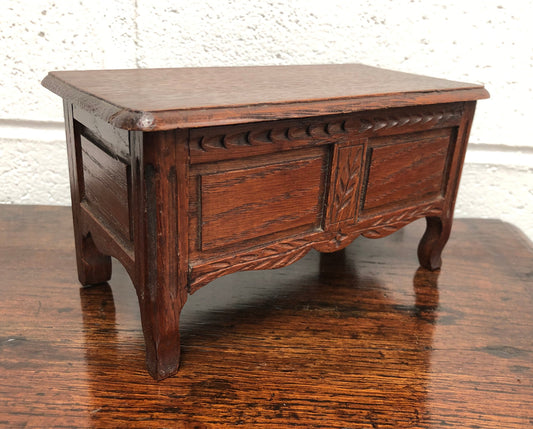 Beautiful Antique oak miniature coffer lined with lovely fabric and would make a fabulous jewellery box . In good condition.