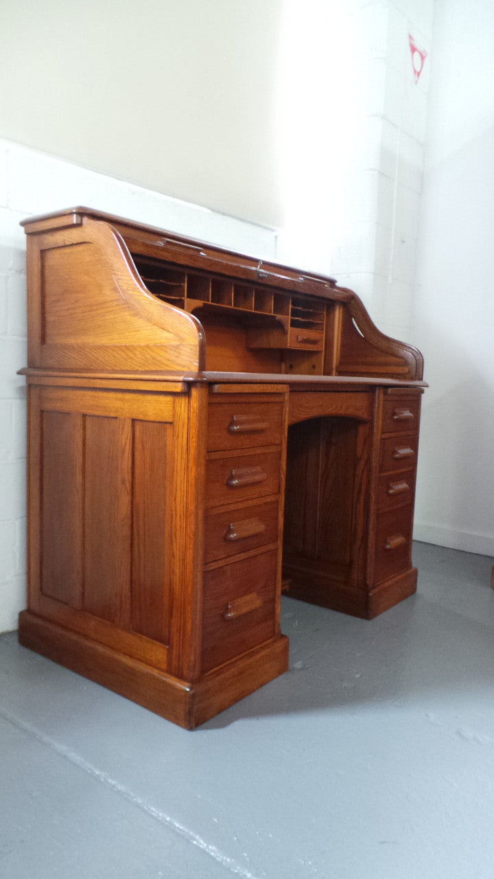 An Antique English Oak Roll Top Desk