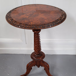 Rare early Victorian Irish Burr Walnut wine table. It has a beautiful carvings and a stunning burr walnut top, on a barley twist column and three shaped legs. It has been sourced locally and is in good original detailed condition. We also have a second table being sold separately which when together make a matched pair.
