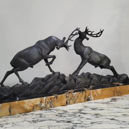French Art Deco bronzed spelter and marble"Fighting Stags" statue by renowned artist and sculptor "Irenee Rochard".