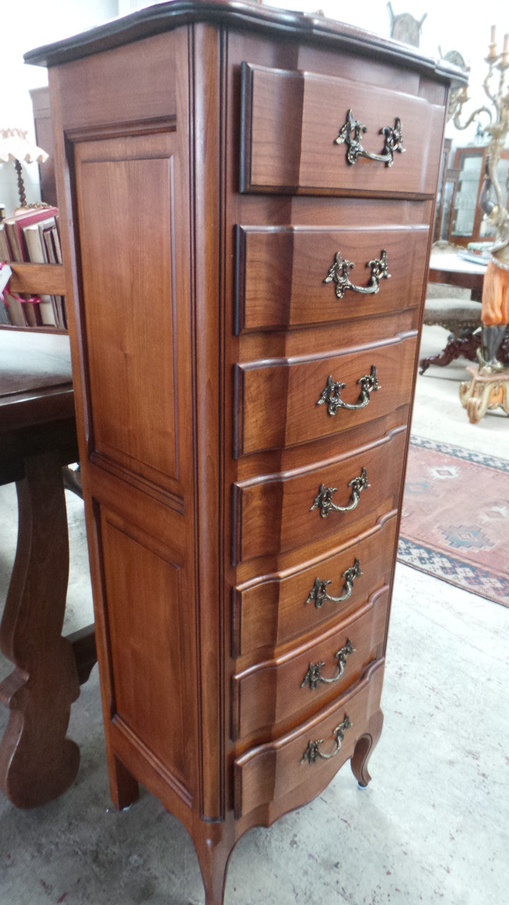 A fabulous petite French Louis XVI style, cherrywood seven drawer semainier. In very good condition.