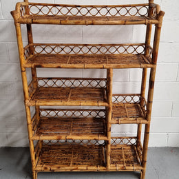 Vintage Tortoiseshell Bamboo Shelves.  Good size unit with irregular shelves. It is in good original condition and it very solid.