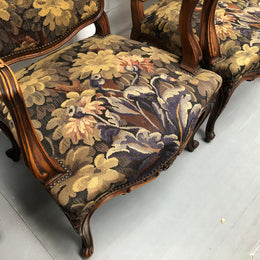 Pair of 19th Century French walnut tapestry covered arm chairs. They are in good original condition. Circa 1890.