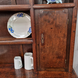 18th Century English Oak Farmhouse dresser of grand proportions. It was sourced in France and not only looks amazing but also has plenty of practical storage space. It is in good original detailed condition.
