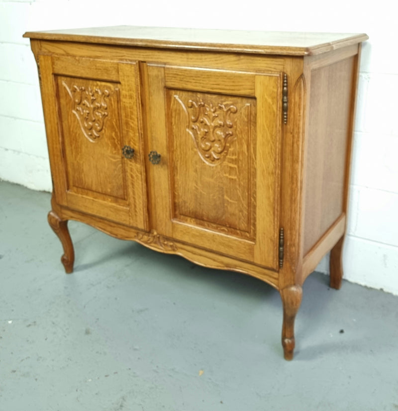 Vintage French Oak two door cabinet which would make an ideal TV cabinet or storage unit. In good original detailed condition.