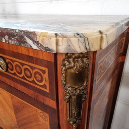 A high quality 19th Century French marquetry inlaid Kingwood marble top credenza. It has an attractive solid marble top and decorative marquetry inlay throughout. It has plenty of storage space with three drawers and three doors. It has been sourced from France and is in good original detailed condition.