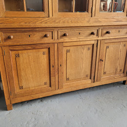 Edwardian Oak dwarf bookcase with six cupboards and three drawers. In very good original detailed condition.