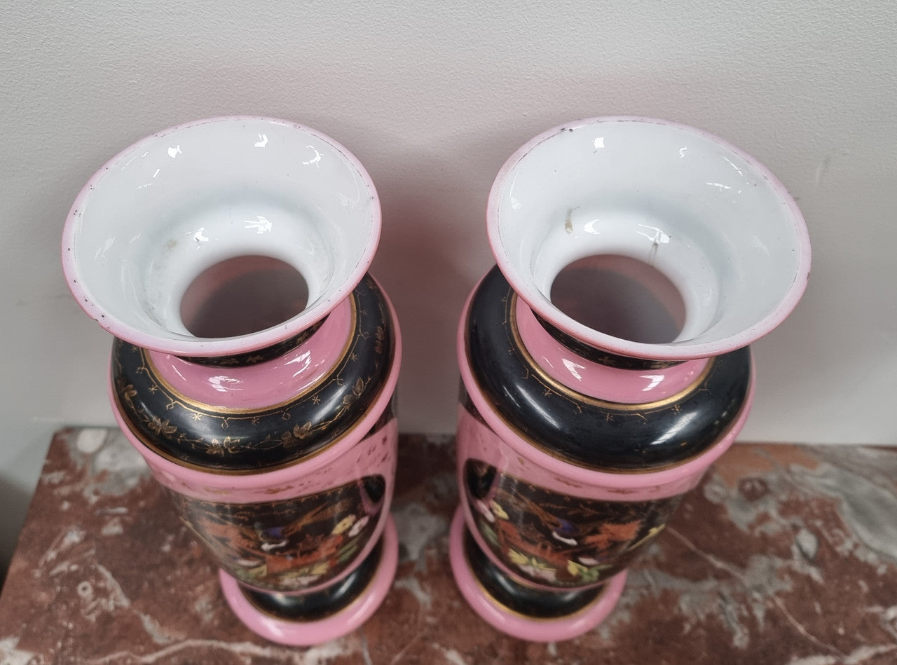 Late Victorian pink and hand painted, enameled pair of vases with some ware to enameling. It is in good original condition.
