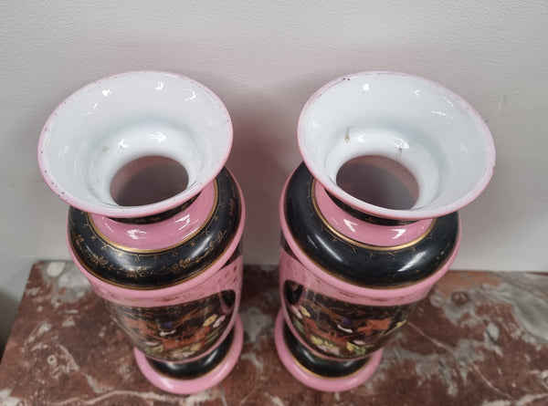 Late Victorian pink and hand painted, enameled pair of vases with some ware to enameling. It is in good original condition.