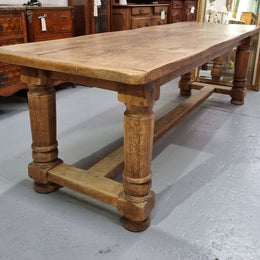 French Oak stretcher base farmhouse table with solid turned legs. It is in good original condition.
