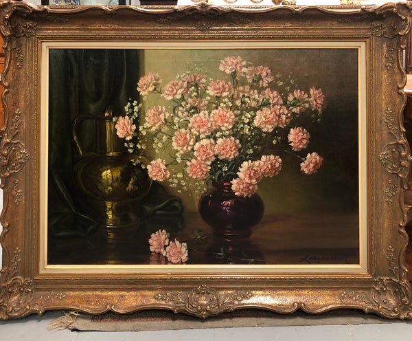 A signed oil on canvas painting of Carnations flowers in an ornate gilt original frame. Circa 1900's in good original condition.