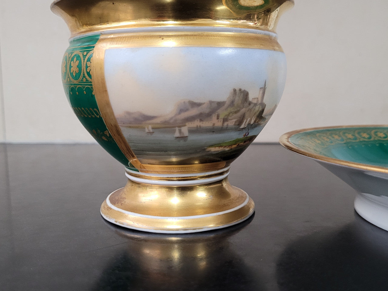 “Old Paris Porcelain” large cup and saucer with hand painted river landscape featuring castles. Gilt and enamel decoration. Circa: early 19th Century. In good original condition please view photos as they help form part of description.