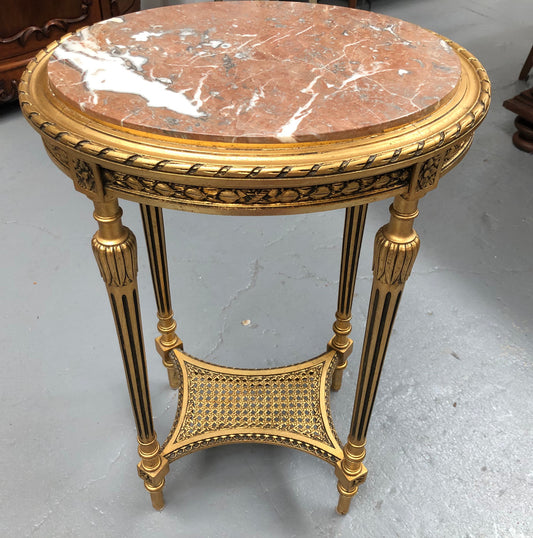 Antique French Louis XVI style gilt, ebonised and marble top side/occasional table. It is Walnut wood that has been gilded over. In good original condition.