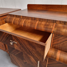 Vintage Walnut Art Deco “Waterfall” sideboard buffet with two drawers and two doors. It is in good original condition and has been sourced locally.