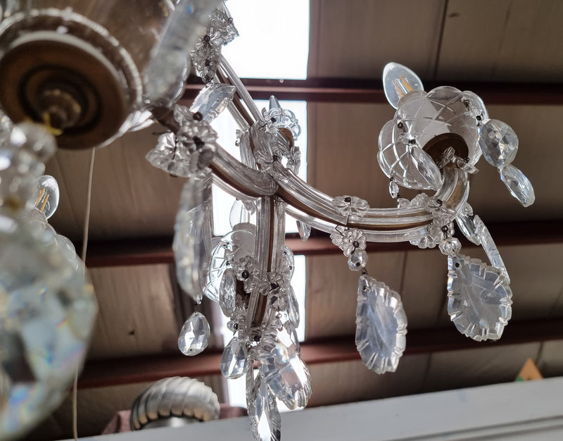 Sourced From France an attractive eight arm French crystal chandelier. It has been fully rewired to Australian standards and is in good original working condition.