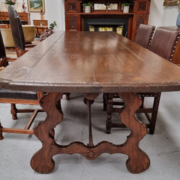 Amazing hard to find French Fruitwood Spanish style 3 meter dining table. Decorative iron work underneath and in good detailed original condition.