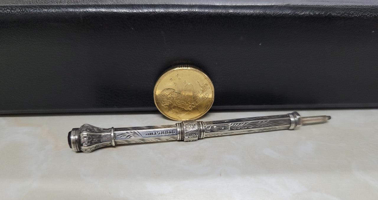 Interesting sterling silver and amethyst propelling and extending pencil. In good original condition, please view photos as they help form part of the description.