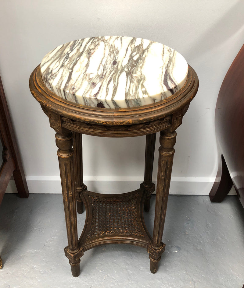 French round two tier marble top gilt wood side table. In good original detailed condition.