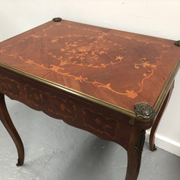 Beautiful french inlaid games table which includes internal drawers and bronze mounts. Internal drawers have counters and cards included.