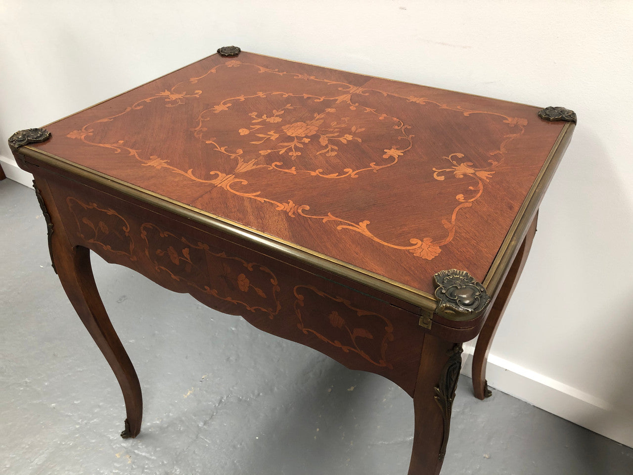 Beautiful french inlaid games table which includes internal drawers and bronze mounts. Internal drawers have counters and cards included.