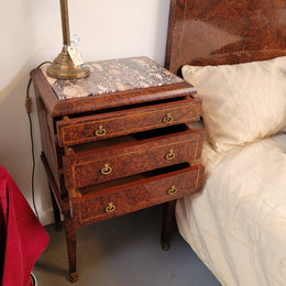 French Art Deco bedroom suite consisting of queen size bed in Amboyna wood and featuring pretty inlay. It comes with a matching pair of bedsides. It is a very stylish and high quality suite. It has been sourced from France and is in good original detailed condition.