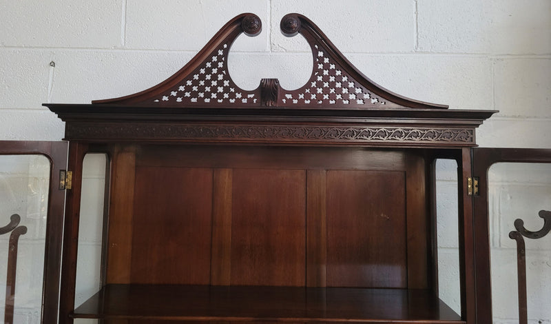 Stunning Mahogany Georgian style Sheraton display cabinet with superb carving and detail. Retaining the original bevelled glass doors with astral glazing. In great original detailed condition.