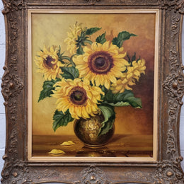 French signed oil on canvas depicting sunflowers in an attractive gilt frame. It is in good original detailed condition and has been sourced from France.
