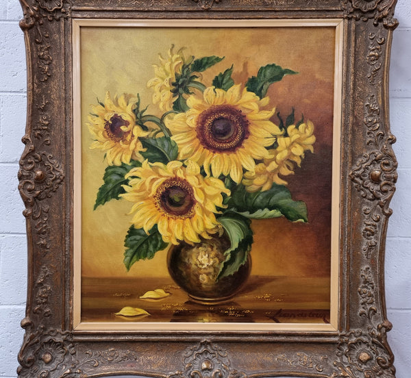 French signed oil on canvas depicting sunflowers in an attractive gilt frame. It is in good original detailed condition and has been sourced from France.