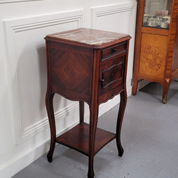 French Rosewood inset marble top single bedside cabinet with one drawer and one cupboard on elegant legs. Would also make a practical and stunning table lamp. It is in good original detailed condition.