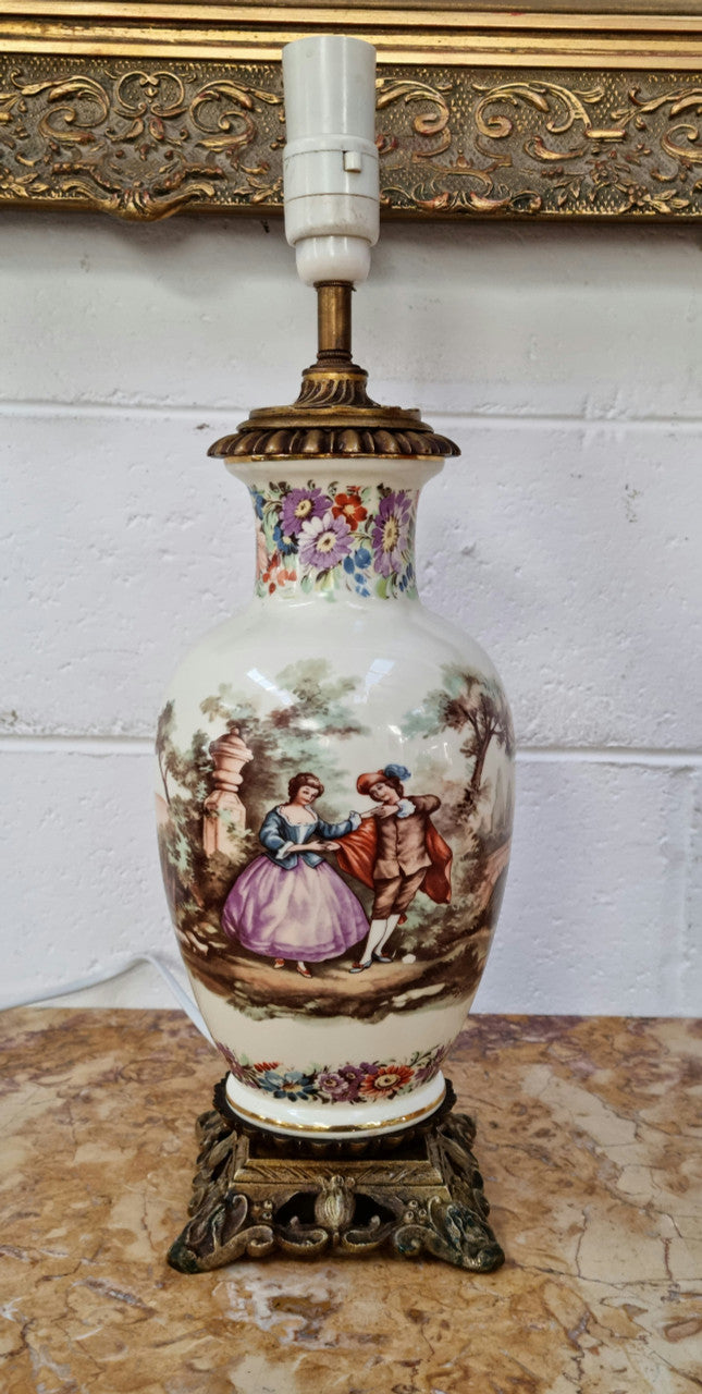 Beautiful French ceramic hand painted and transferred decorative table lamp. It has a lovely gilt bronze base and in good working order.