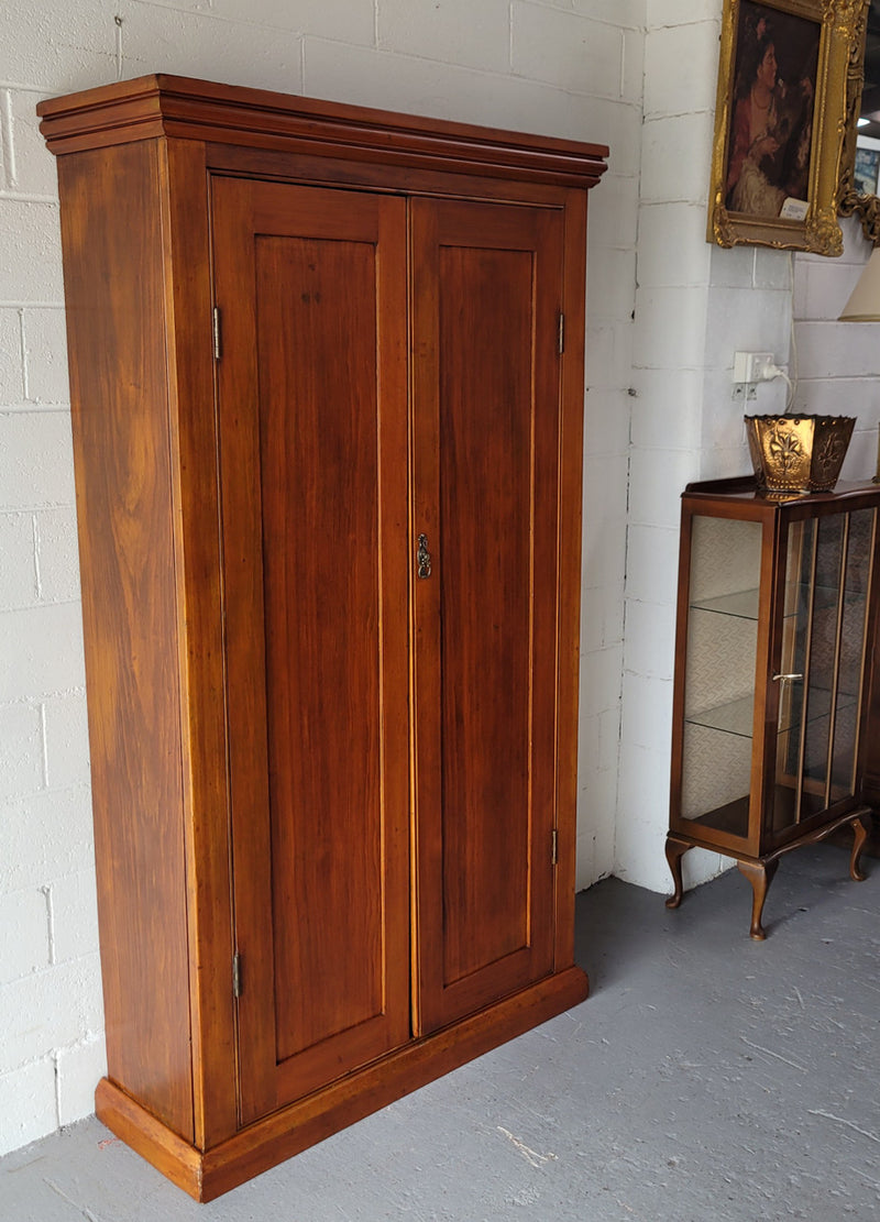 Australian Victorian Pine storage cupboard of pleasing narrow portions. Heaps of storage space and is in very good original detailed condition.