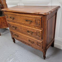 French Louis XV style Oak three drawer chest with wooden top. It has been sourced from France and is in good original detailed condition.