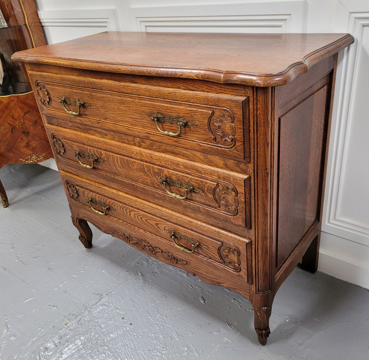 French Louis XV style Oak three drawer chest with wooden top. It has been sourced from France and is in good original detailed condition.