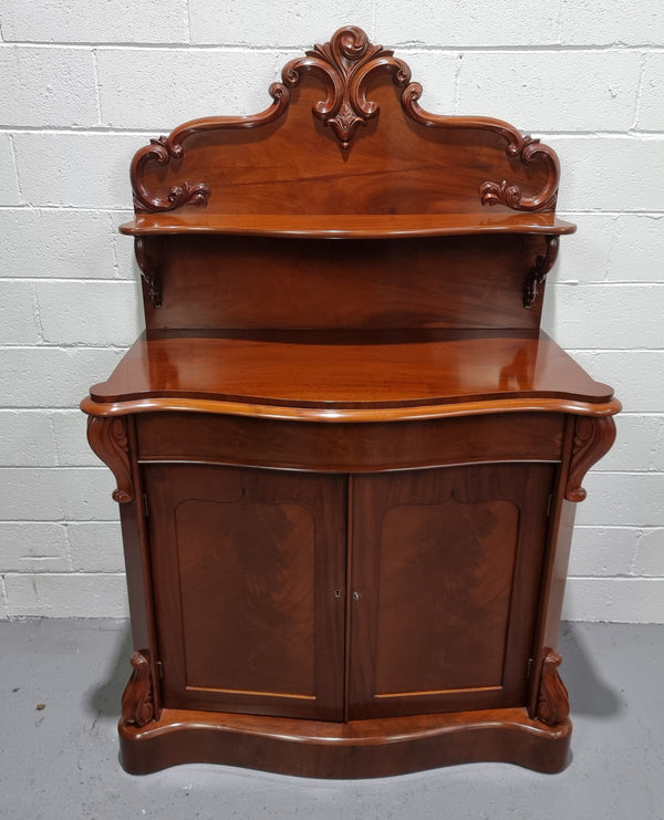 Beautiful Antique Victorian Mahogany two door Chiffonier. Plenty of storage space with one drawer and the two doors open up to a shelved area. It is in good restored condition.