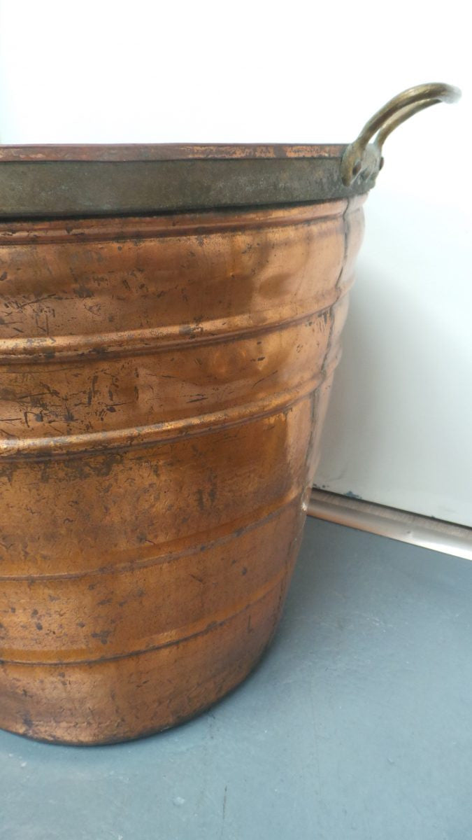 A fabulous French rustic antique copper and brass two handled bucket. Has loads of character and would make a great bucket for firewood. It is in very good original condition