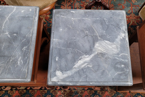 Pair of unusual transitional fruit wood marble top bedside cabinets. They have been sourced from France and are in good original detailed condition.