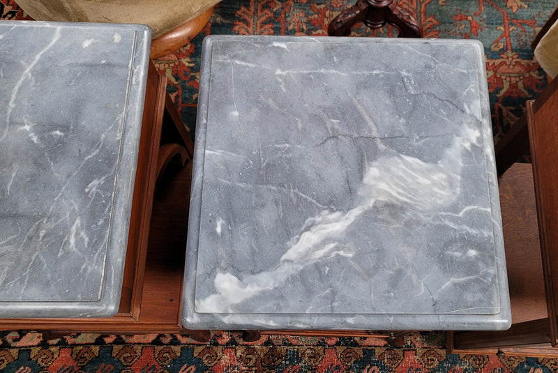 Pair of unusual transitional fruit wood marble top bedside cabinets. They have been sourced from France and are in good original detailed condition.